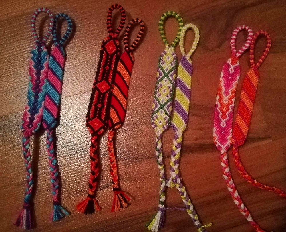 4 sets of 2 bracelets each, all of them with different color schemes.